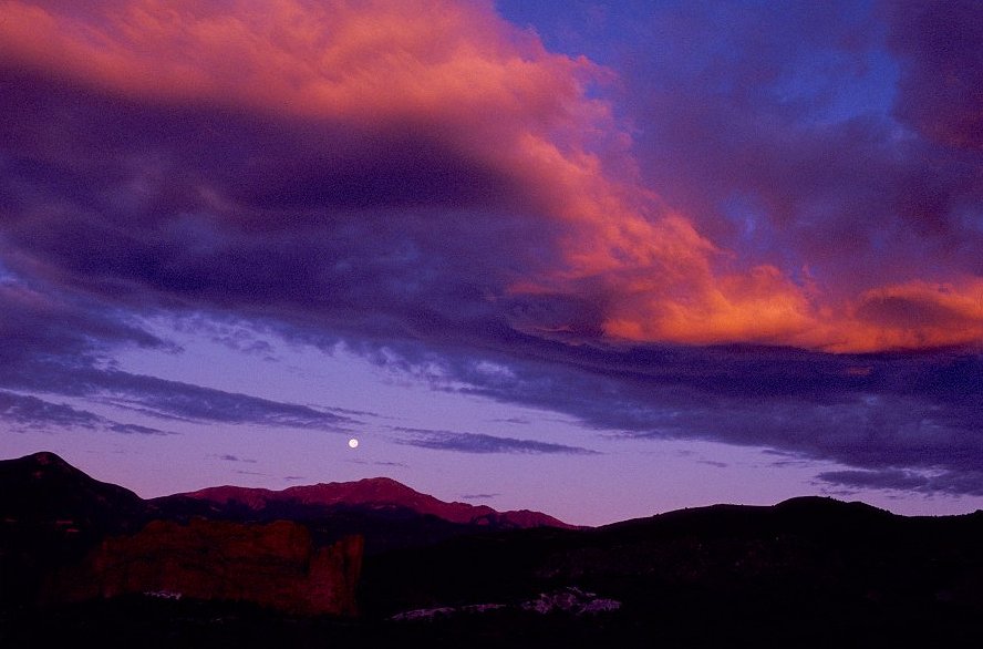 Pikes Peak Moonset and Red Clouds